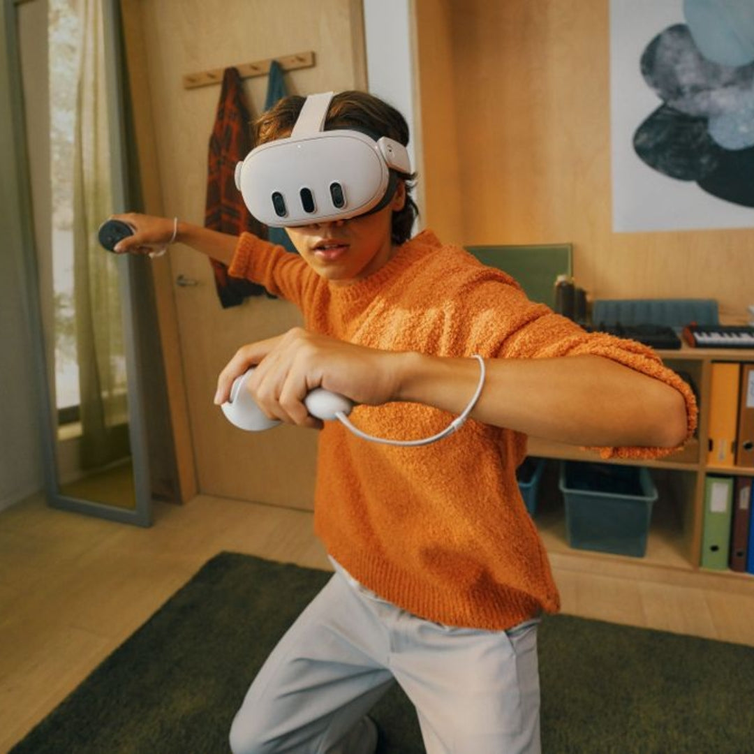 meta quest 3 in use by a women with vr controlers